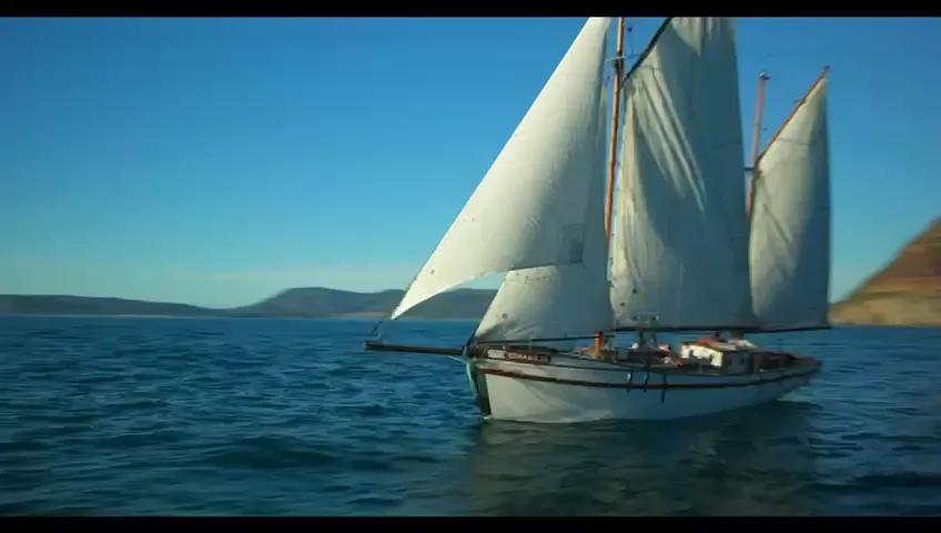 Tall ship under full sail off the Cape coast